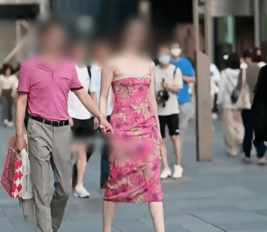 拍“国企负责人与异性同事亲密牵手”的摄影师，立功还是担责？